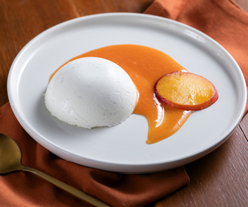 Panna cotta avec coulis de pêches